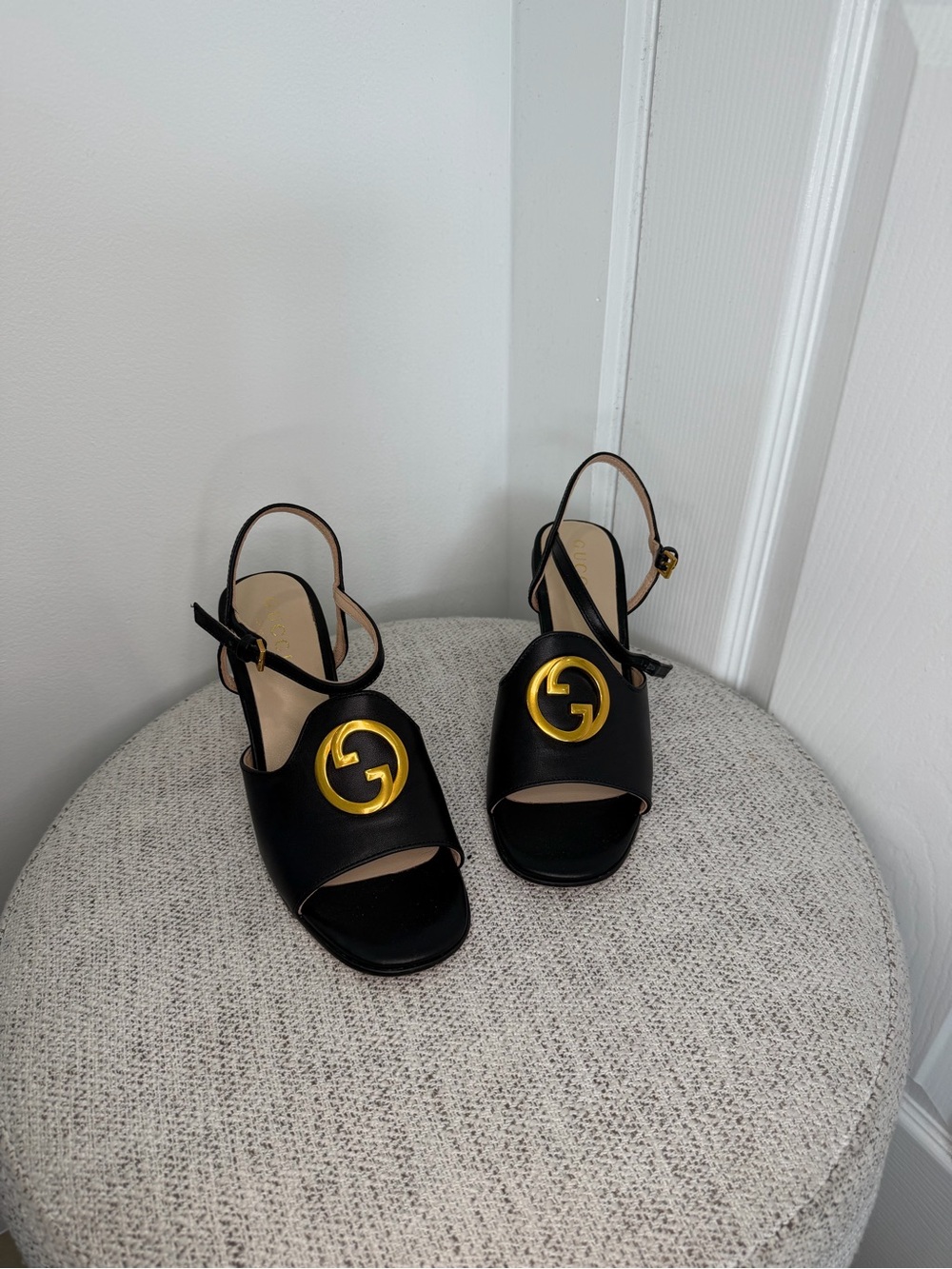 Black Leather Slingback Sandals with Gold Emblem